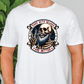 a man wearing a white t - shirt with a skull on it