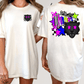 two different views of a white t-shirt with a graphic design on the back. The design features a black panther with pink eyes, surrounded by colorful stars and other abstract shapes.