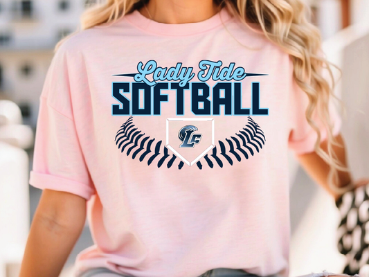 A woman wearing a pink t-shirt with the text "Lady Tide Softball" printed on it.