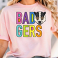 A woman wearing a pink t-shirt with the text "BAD GERS" printed on it.