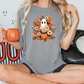 a woman sitting on a bed holding a pumpkin