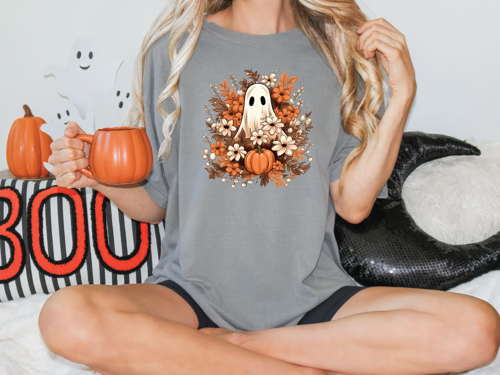 a woman sitting on a bed holding a pumpkin