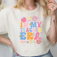 a woman wearing a t - shirt that says i'm my teacher era