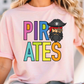A woman wearing a pink t-shirt with the text "PIRATES" and a cartoon pirate character on it.