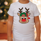 a little boy wearing a white shirt with a reindeer head on it