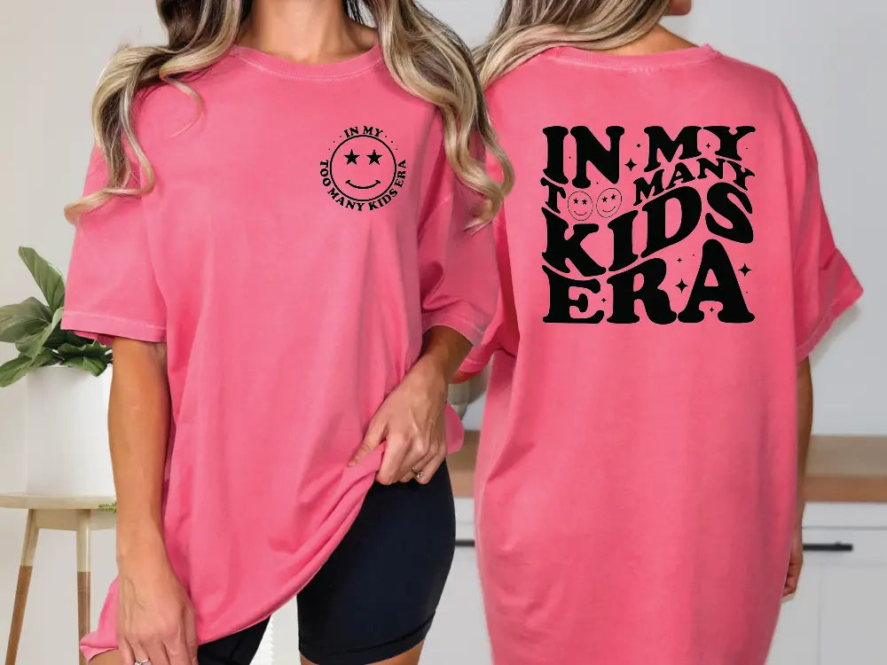 two women wearing pink shirts that say in my many kids era