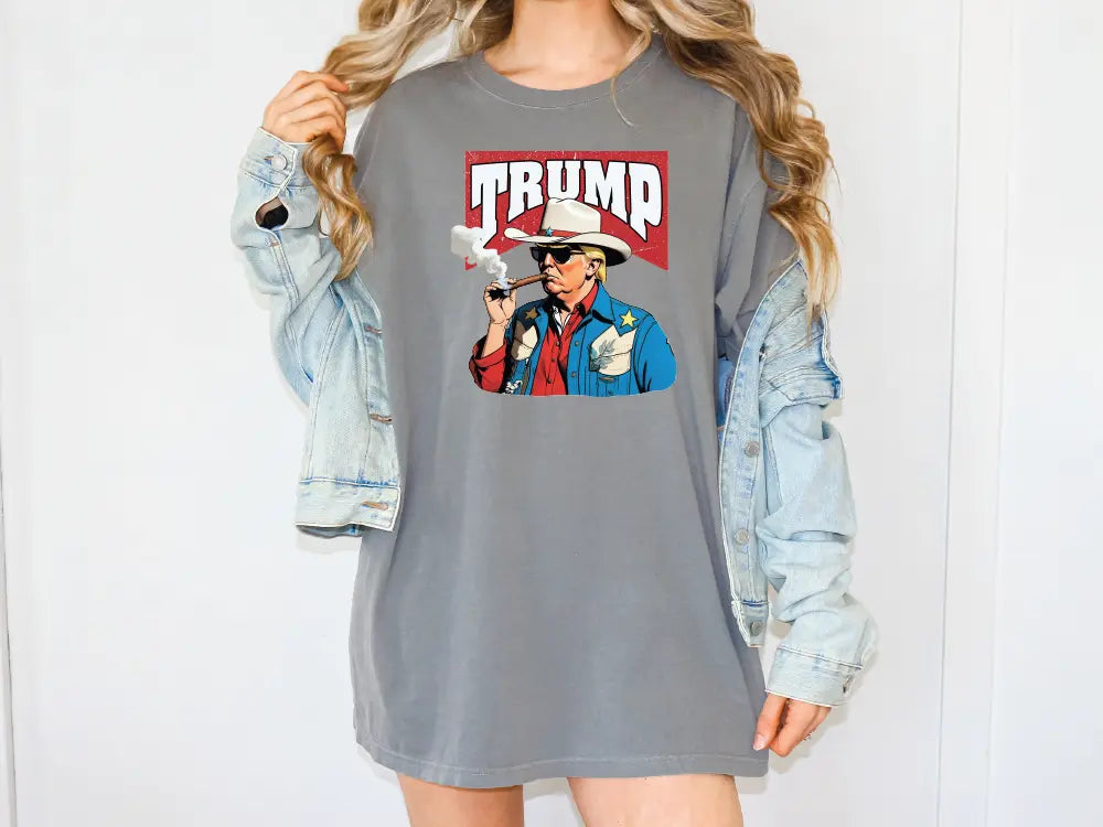 a woman wearing a trump shirt and denim jacket