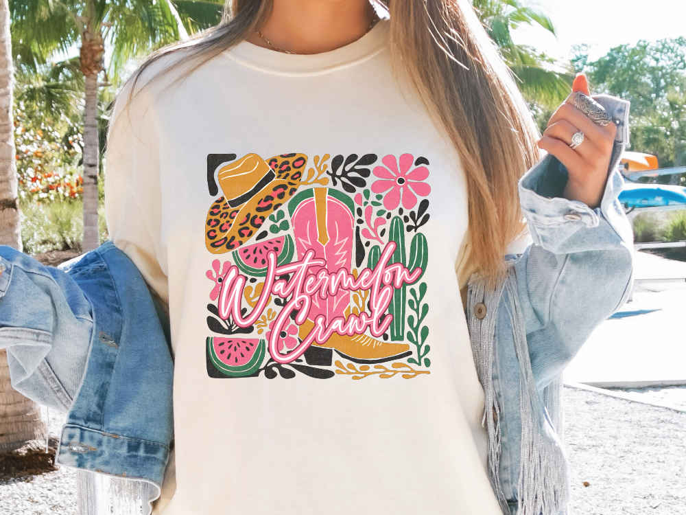 a woman wearing a t - shirt with a picture of a woman holding a cell