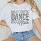 a woman sitting on a couch wearing a t - shirt that says dance dance dance