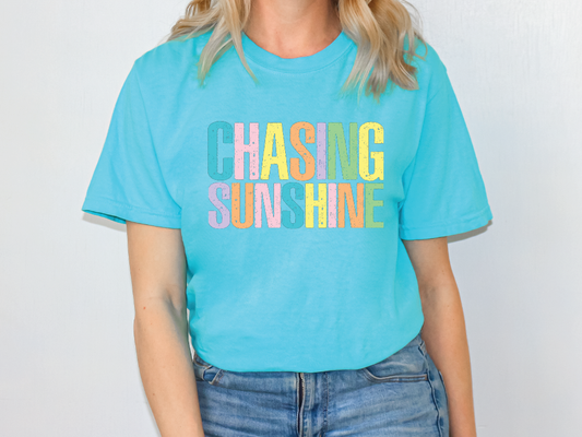 a woman wearing a blue shirt that says hashing sun shine