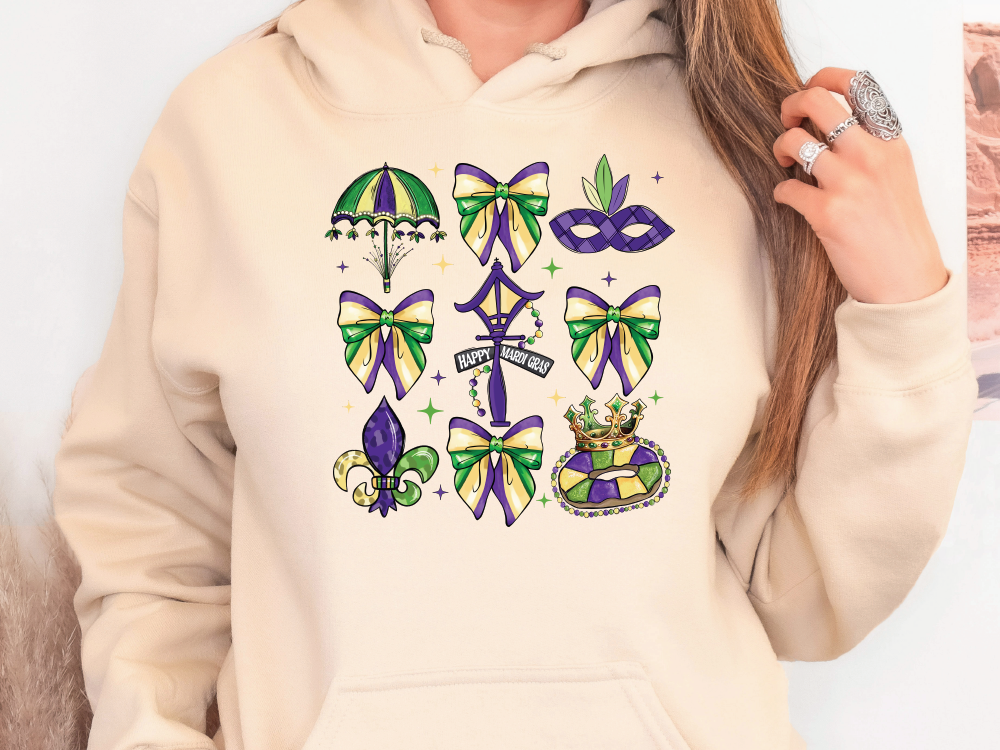 a woman wearing a hoodie with mardi gras decorations on it