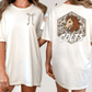 two women wearing white t-shirts with different designs on the back.