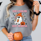 a woman wearing a very demure very mindful halloween t - shirt