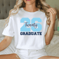 A woman wearing a white t-shirt with the number 26 and the text "Twenties Graduate" printed on it.