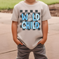 a young boy wearing a t - shirt that says wild child