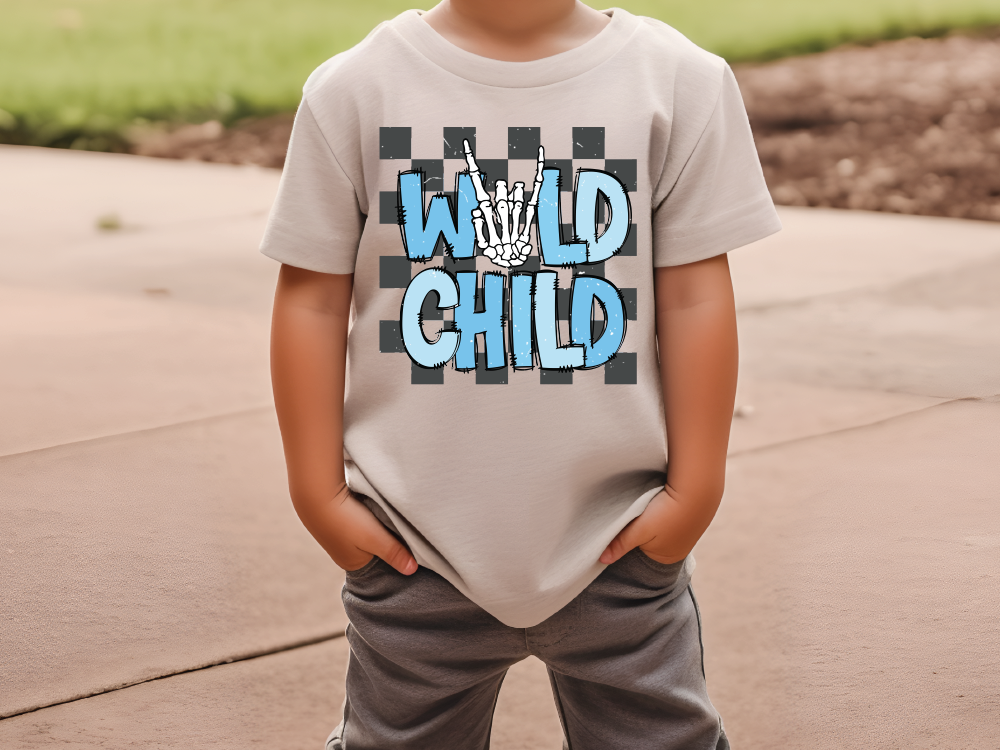 a young boy wearing a t - shirt that says wild child