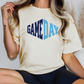 a woman wearing a t - shirt with the word game day printed on it