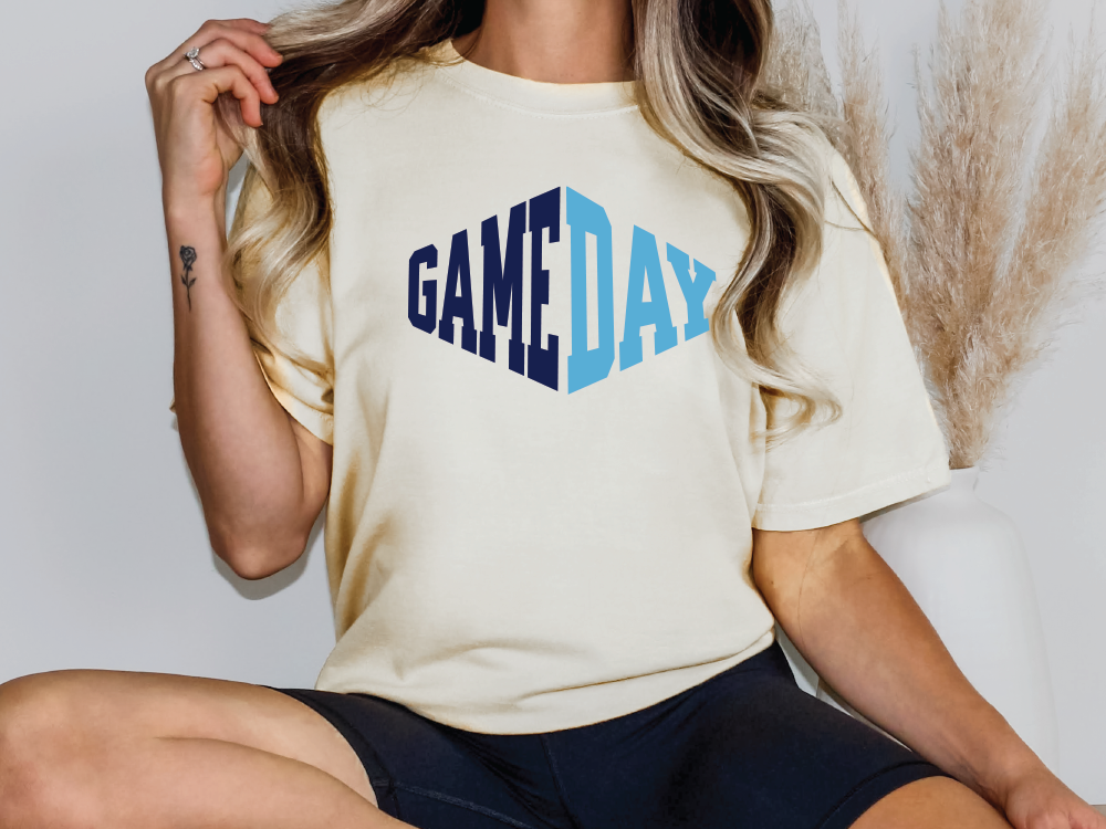 a woman wearing a t - shirt with the word game day printed on it