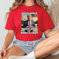 a woman wearing a red shirt with a picture of a man on it