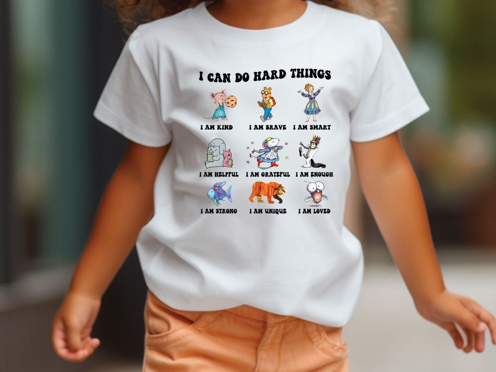 a little girl wearing a t - shirt that says i can do hard things