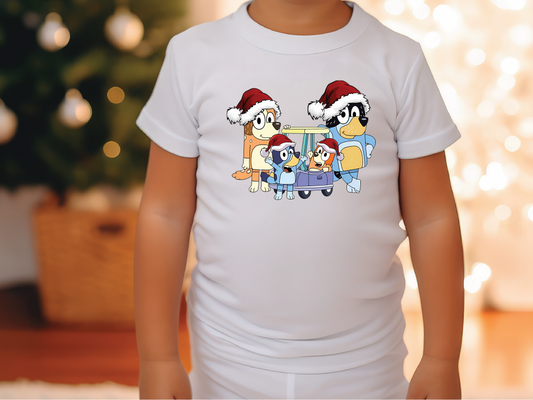 a little girl wearing a white shirt with cartoon characters on it