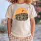 A child wearing a white t-shirt with an orange baseball cap and a camouflage pattern printed on it.
