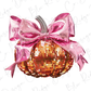 a pink and gold sequinized pumpkin with a bow