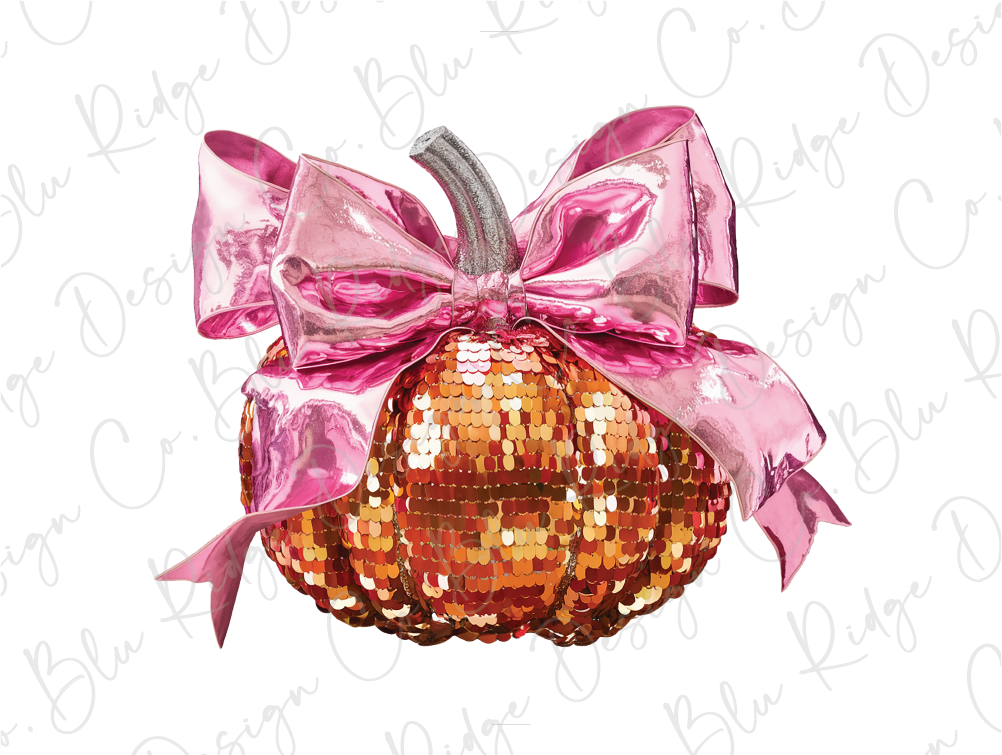 a pink and gold sequinized pumpkin with a bow