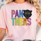A woman wearing a pink t-shirt with the text "PANTHERS" and a graphic of a panther's face with stars on its eyes.