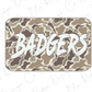 A camouflage-patterned sticker or decal with the word "BADGERS" written in a stylized, graffiti-like font.
