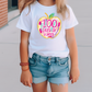 a little girl wearing a 100 days of school shirt