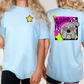 two women wearing light blue t-shirts with a graphic design on the back. The design features a bulldog wearing sunglasses and a star.