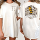 two different views of a white t-shirt with a graphic design on the back. The design features a bee and the word "Horns" written on it.