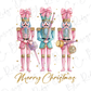 three nutcrackers wearing pink and blue outfits