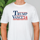 a man wearing a trump t - shirt in front of a plant