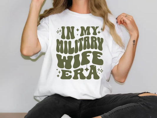 a woman wearing a military wife t - shirt