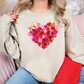 a woman sitting on a couch wearing a sweater with a heart painted on it