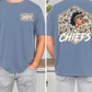 a man wearing a blue t-shirt with a graphic design on the back. The design features a Native American headdress and the word "CHIEFS" written below it.