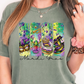 a woman wearing a t - shirt with mardi gras on it