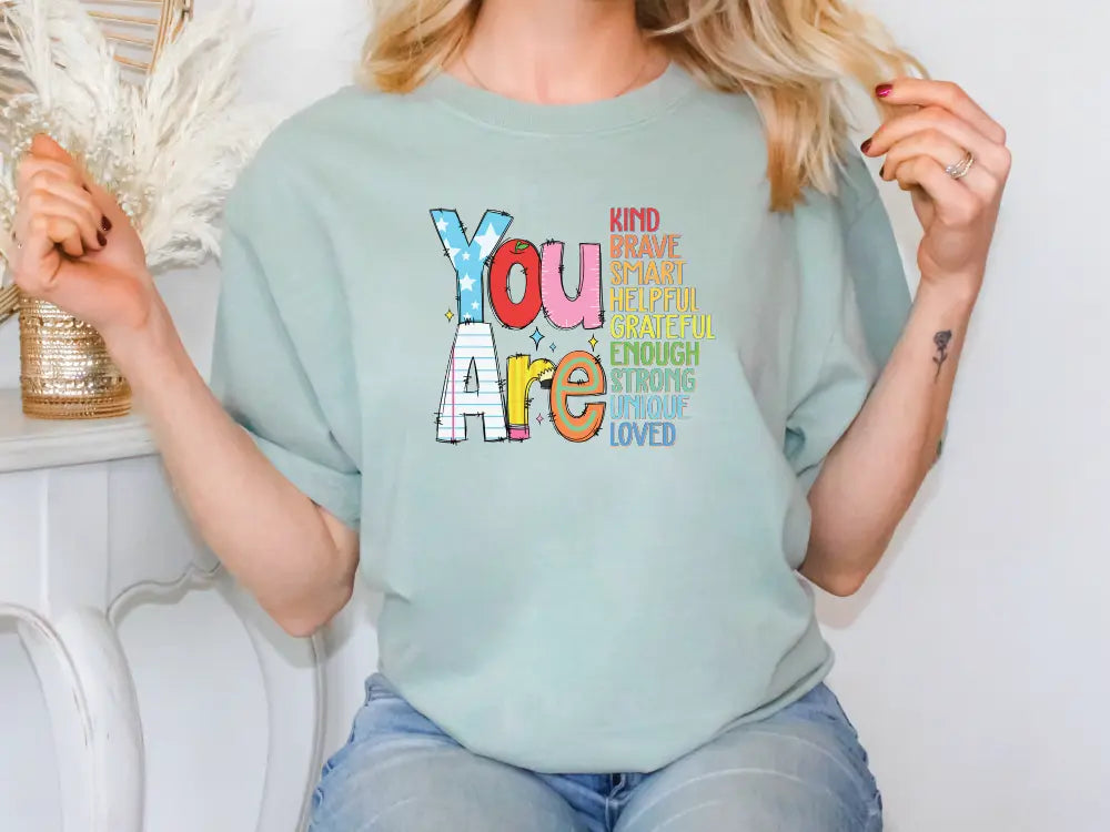 a woman wearing a t - shirt that says you are