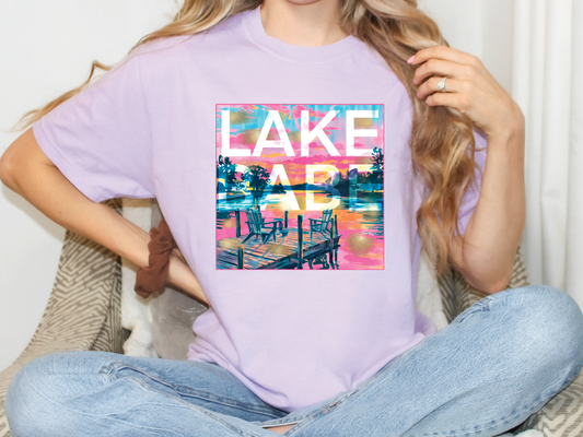 a woman sitting on a couch wearing a lake art t - shirt