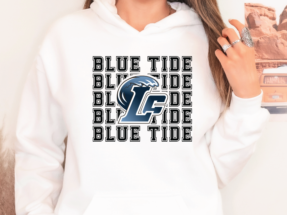 a woman wearing a white hoodie with a blue tide logo on it