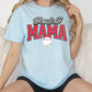 a woman sitting on a couch wearing a baseball mama shirt