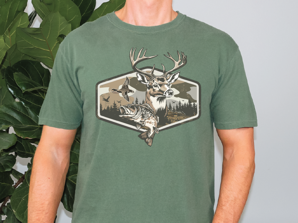 A green t-shirt with a graphic design depicting a deer, a bird, and a fish.