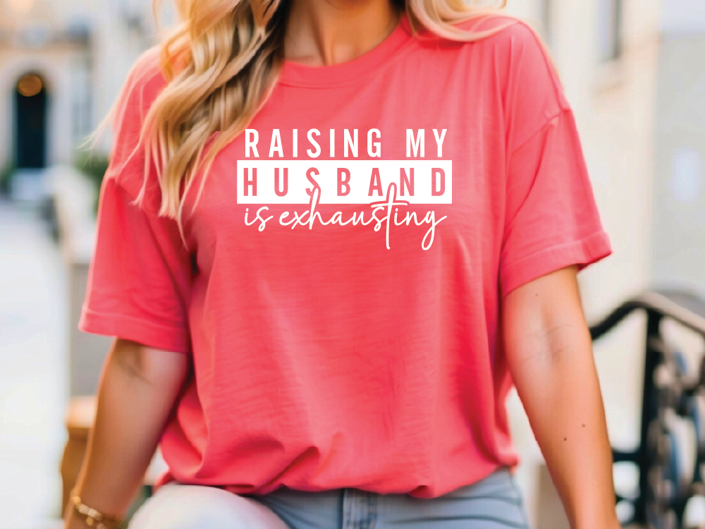 a woman wearing a red shirt that says raising my husband is fascinating