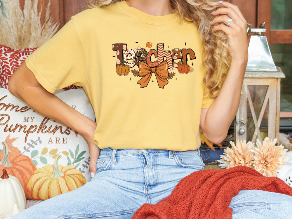 a woman sitting on a couch wearing a yellow shirt