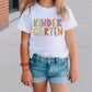 a little girl wearing a white shirt and denim shorts