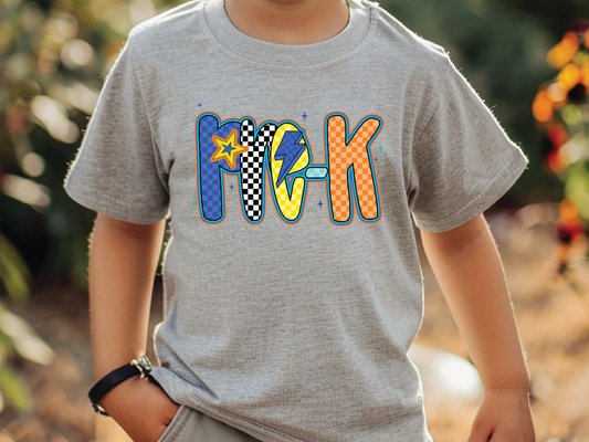 a young boy wearing a gray shirt with the word rock on it