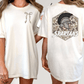 two different views of a white t-shirt with a graphic design on the back. The design features a helmet with a plume and the word "SPARTANS" written below it.