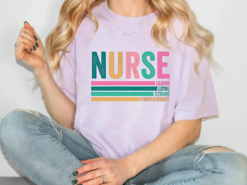 a woman sitting on the floor wearing a nurse t - shirt